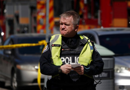 A pedestrian officer responds to an incident where a van struck multiple people at a major intersection in Toronto's northern suburbs in Toronto, Ontario, Canada, April 23, 2018. REUTERS/Carlo Allegri