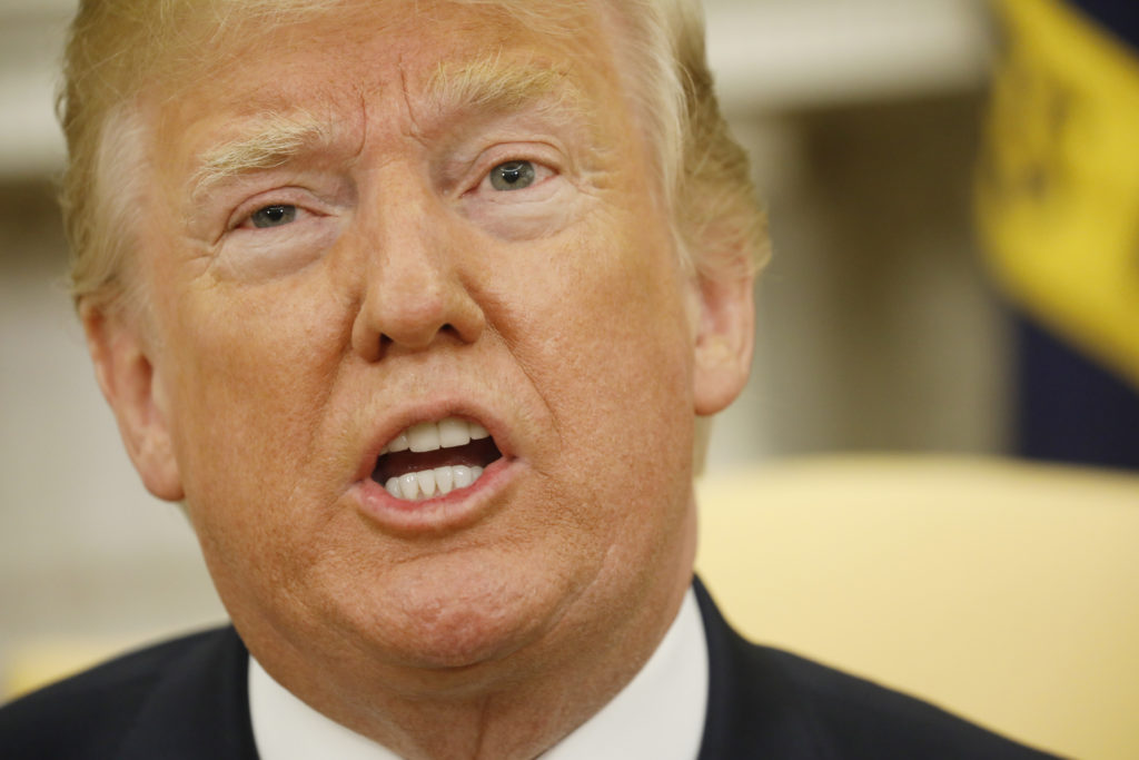 U.S. President Donald Trump speaks during his Oval Office meeting with French President Emmanuel Macron (not pictured) fol...
