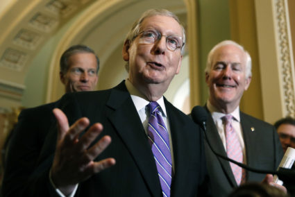 Senate Majority Leader Mitch McConnell of Ky., center, speaks during a media availability after a policy luncheon on Capitol Hill, Tuesday, May 8, 2018 in Washington. McConnell is accompanied by Sen. John Thune, R-S.D., left, and Sen. John Cornyn, R-Texas. (AP Photo/Alex Brandon)