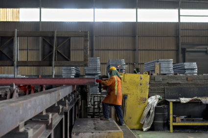 An employee tags a red hot steel slab during production at the NLMK Indiana facility in Portage, Indiana, U.S., on Friday, April 13, 2018. Novolipetsk Steel PJSC shares rose 5.3 percent, more than any full-day gain since December 11. Photographer: Daniel Acker/Bloomberg via Getty Images