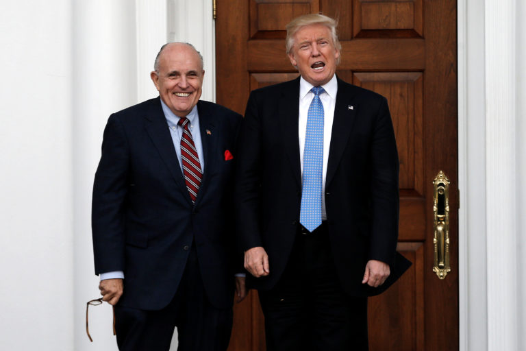 U.S. President-elect Donald Trump stands with former New York City Mayor Rudolph Giuliani before their meeting at Trump National Golf Club in Bedminster, New Jersey, U.S., November 20, 2016. REUTERS/Mike Segar