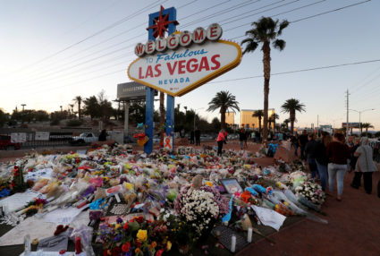 The "Welcome to Las Vegas" sign is surrounded by flowers and items, left after the October 1 mass shooting, in Las Vegas, Nevada U.S. October 9, 2017. Photo by Las Vegas Sun/Steve Marcus/REUTERS