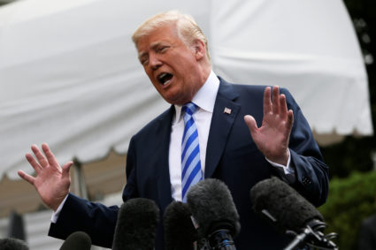 President Donald Trump talks to the media before boarding Marine One to travel to Texas from the South Lawn of the White House in Washington, D.C. Photo by Matej Leskovsek/Reuters