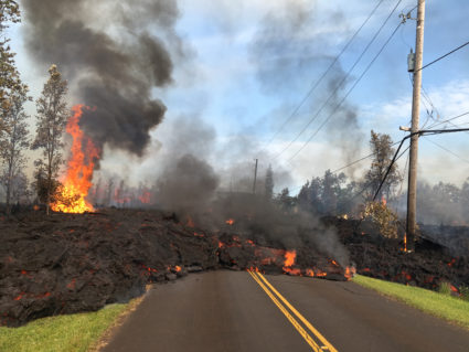 Lava advances along a street near a fissure in Leilani Estates, on Kilauea volcano's lower East Rift Zone, Hawaii. Photo by U.S. Geological Survey/Handout via Reuters