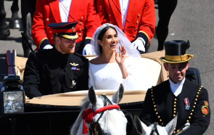 Prince Harry and his wife Meghan Markle take a spin around the town of Windsor in a horse-drawn carriage after their wedding ceremony. Photo by Dylan Martinez/Reuters