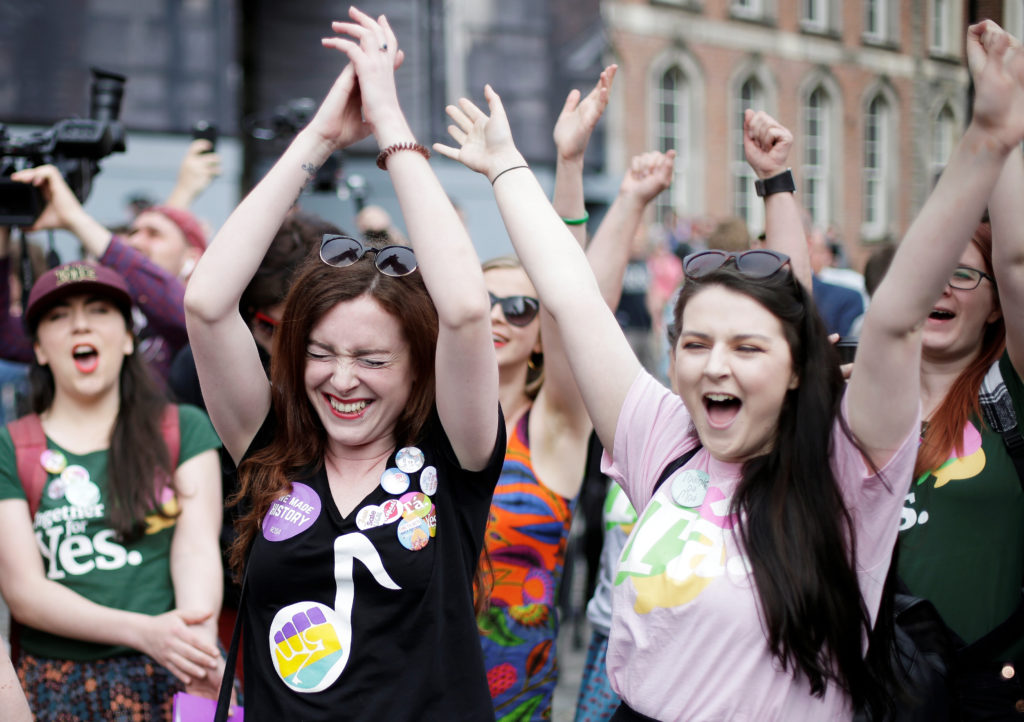 Women celebrate the result of yesterday's referendum on liberalizing abortion law, in Dublin