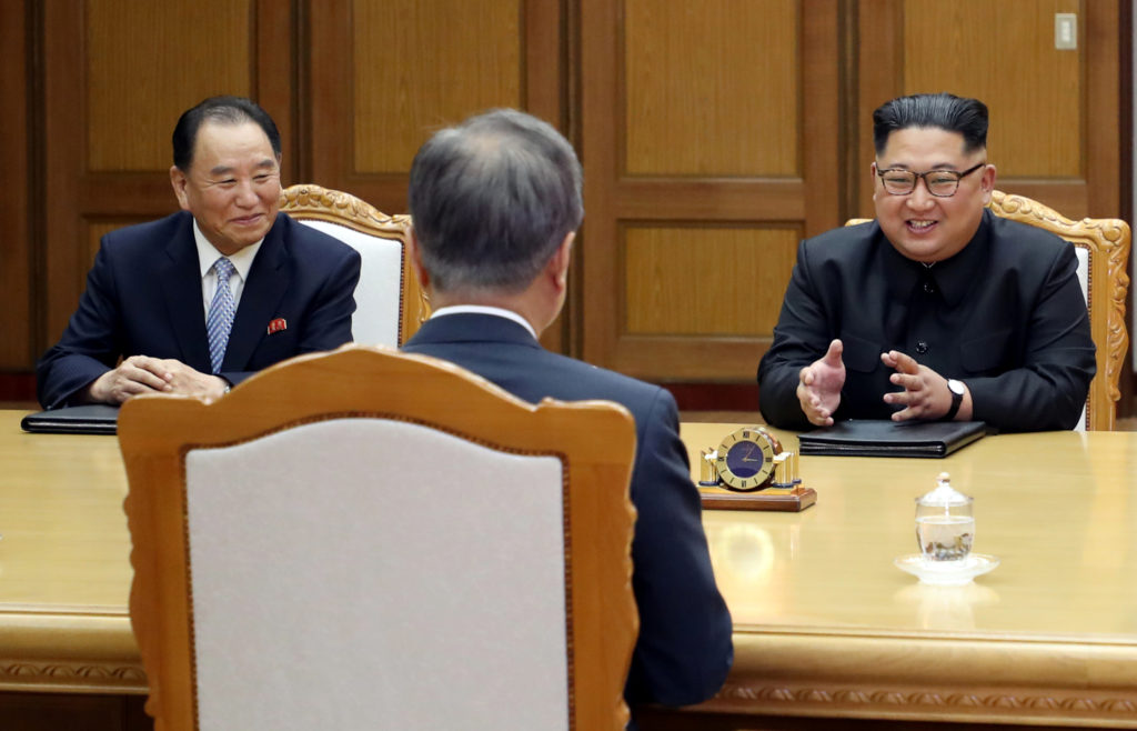 North Korean leader Kim Jong Un talks with South Korean President Moon Jae-in as Kim Yong Chol, North Korea's vice chairma...
