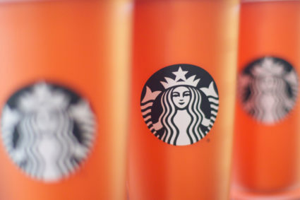 Branded Starbucks mugs line up on a shelf, before more than 8,000 branches nationwide will close this afternoon for anti-bias training, in Philadelphia, Pennsylvania. Photo by Mark Makela/Reuters