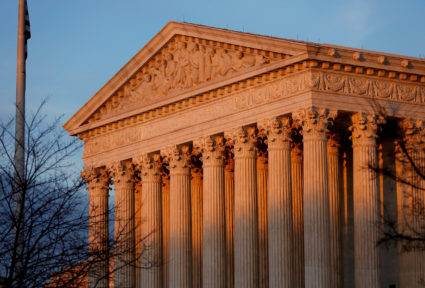 Light from the setting sun shines on the Supreme Court in Washington, D.C. Photo by Joshua Roberts/Reuters