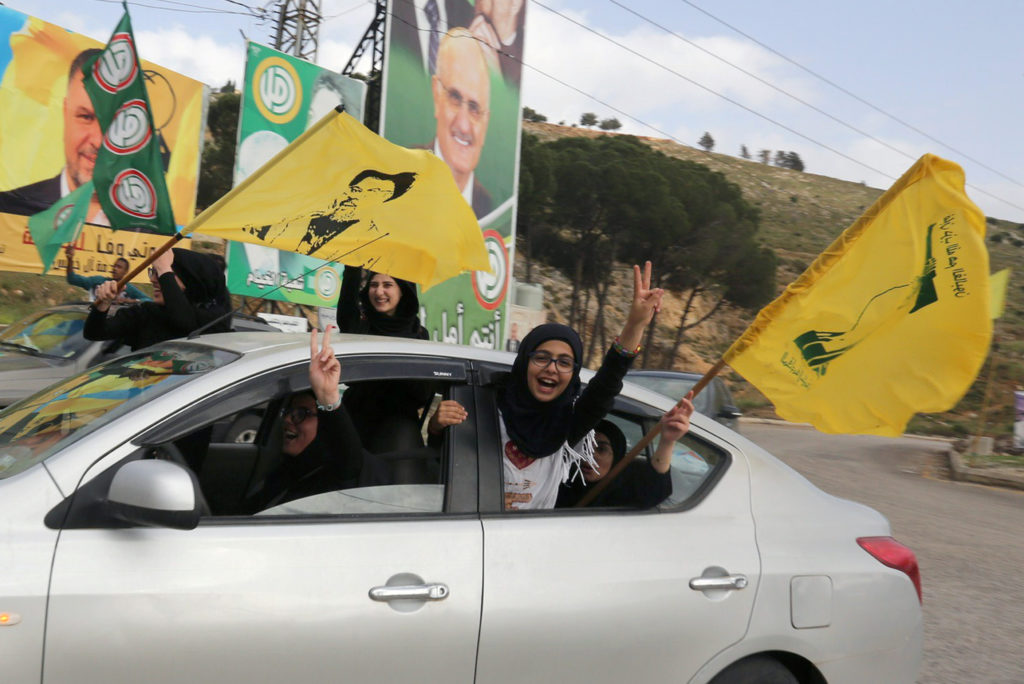 Supporters of Lebanon's Hezbollah gesture out of a car window in Marjayoun, Lebanon May 7, 2018. REUTERS/Aziz Taher