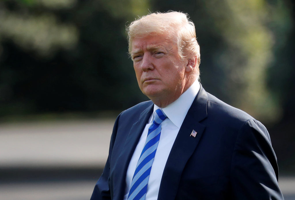 President Donald Trump walks to Marine One to depart for Walter Reed National Military Medical Center to visit first lady ...