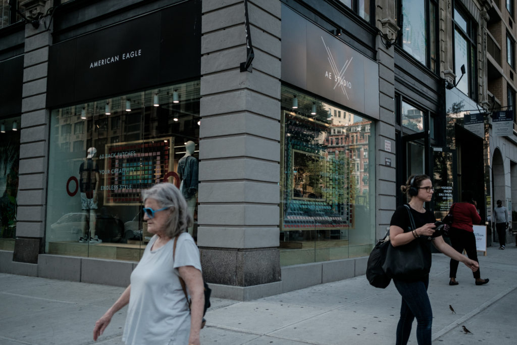 A pedestrian passes in front of an American Eagle Outfitters Inc. store in New York on Tuesday, May 29, 2018. The retail i...
