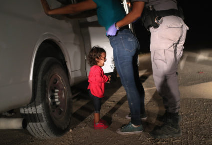 MCALLEN, TX - JUNE 12: A two-year-old Honduran asylum seeker cries as her mother is searched and detained near the U.S.-Mexico border on June 12, 2018 in McAllen, Texas. The asylum seekers had rafted across the Rio Grande from Mexico and were detained by U.S. Border Patrol agents before being sent to a processing center for possible separation. Customs and Border Protection (CBP) is executing the Trump administration's "zero tolerance" policy towards undocumented immigrants. U.S. Attorney General Jeff Sessions also said that domestic and gang violence in immigrants' country of origin would no longer qualify them for political asylum status. (Photo by John Moore/Getty Images)
