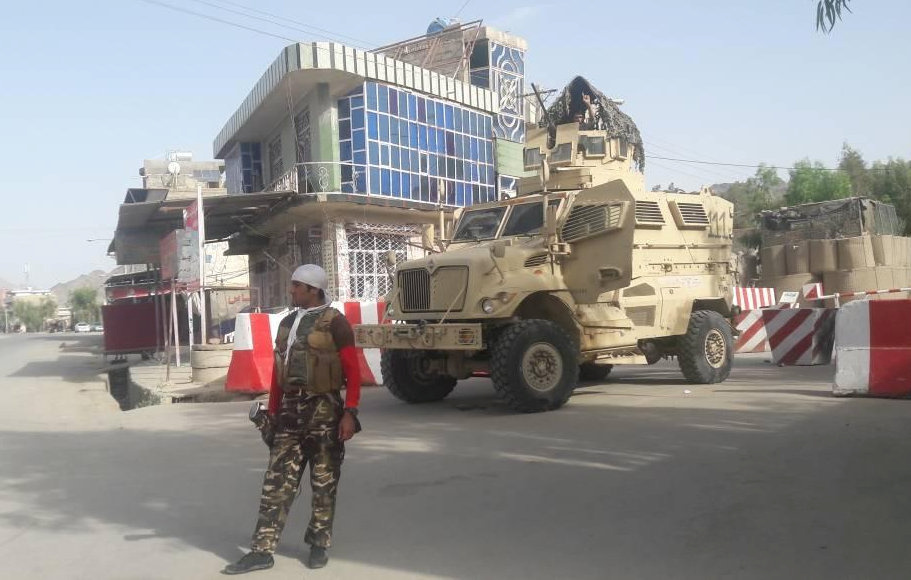 An Afghan guard stands at the entrance of the government compound of Farah province in western Afghanistan on May 15, 2018...
