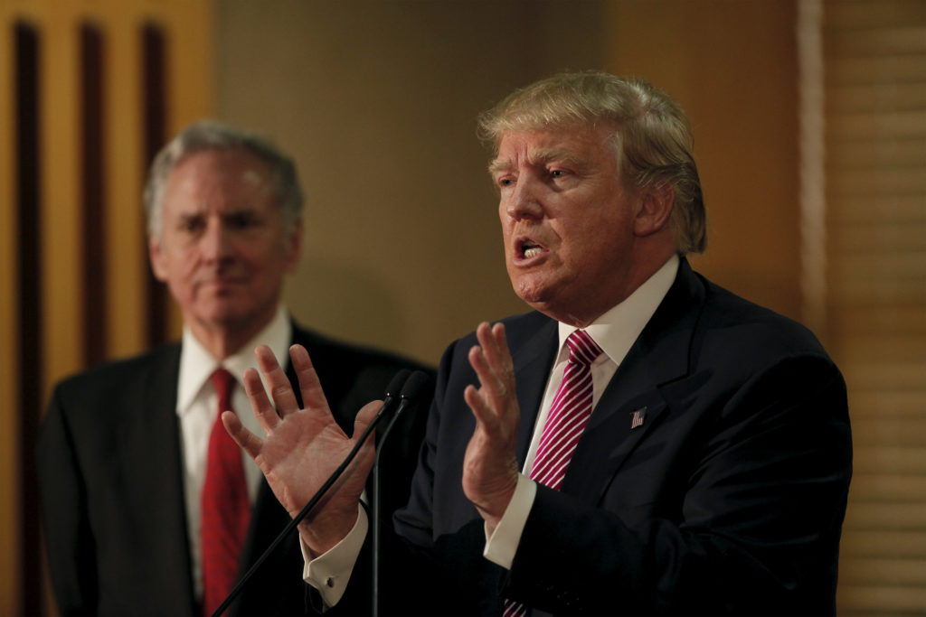 Republican presidential candidate Donald Trump speaks at a news conference while South Carolina Lieutenant Governor Henry ...