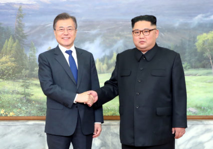 South Korean President Moon Jae-in shakes hands with North Korean leader Kim Jong Un during their May summit at the truce village of Panmunjom, North Korea, in this handout picture provided by the Presidential Blue House. Photo by The Presidential Blue House via Reuters