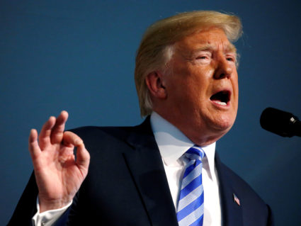 President Donald Trump participates in the U.S. Coast Guard Change-of-Command ceremony at U.S. Coast Guard Headquarters in Washington, D.C. Photo by Leah Millis/Reuters