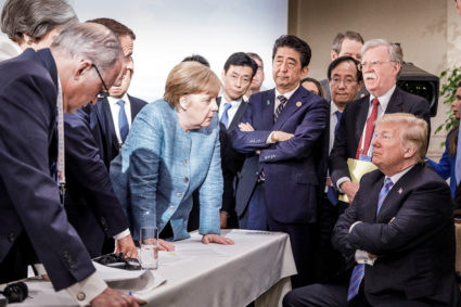 German Chancellor Angela Merkel speaks to U.S. President Donald Trump during the second day of the G7 meeting in Charlevoix city of La Malbaie, Quebec, Canada, June 9, 2018. Bundesregierung/Jesco Denzel via Reuters