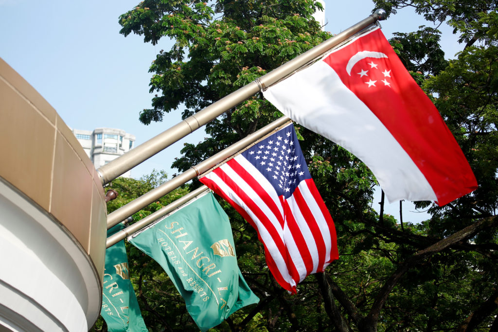 The Singapore and United States flags fly at the Shangri-La Hotel in Singapore. Photo by Feline Lim/Reuters