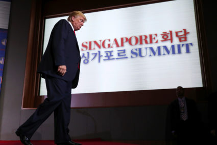 President Donald Trump walks off the stage after a news conference after his meeting with North Korean leader Kim Jong Un at the Capella Hotel on Sentosa island in Singapore. Photo by Jonathan Ernst/Reuters