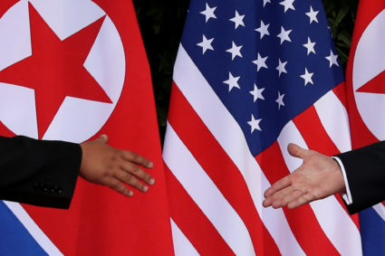 President Donald Trump and North Korea's leader Kim Jong Un meet at the start of their summit at the Capella Hotel on the resort island of Sentosa, Singapore. Photo by Jonathan Ernst/Reuters