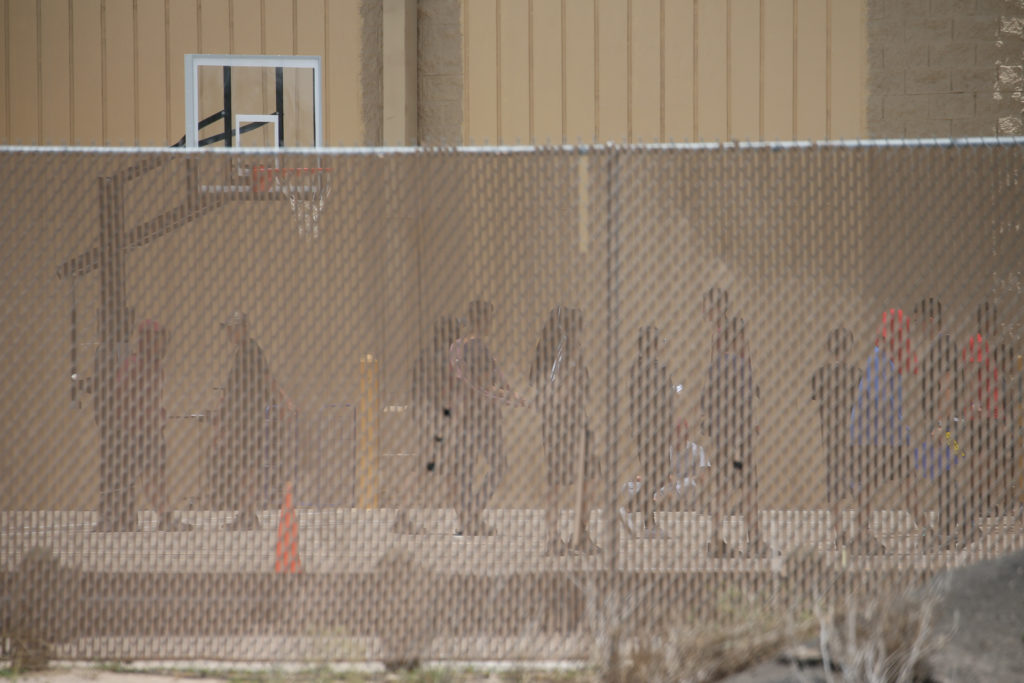 Migrant boys spend time in a recreation area outside Casa Padre, an immigrant shelter for unaccompanied minors, in Brownsv...