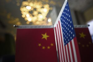 Chinese flags and American flags are displayed in a company in Beijing. After days of talks between U.S. and Chinese leaders, there are no signs of progress over key areas such as market access and theft of trade secrets. Wang Zhao/AFP/Getty Images