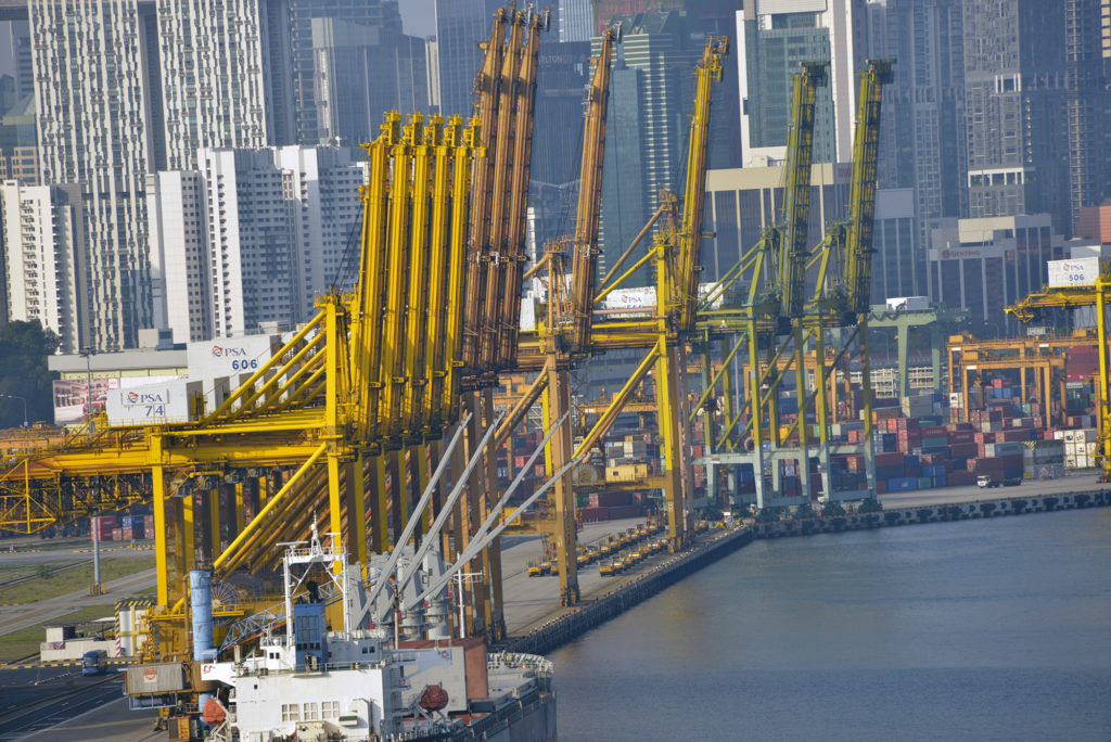 Singapore is a major trading hub in Asia. These are just some of the 200-plus cranes that load and unload more than 32 million cargo containers annually. Photo by Daniel Sagalyn/PBS NewsHour