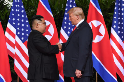 North Korea's leader Kim Jong Un (L) shakes hands with US President Donald Trump (R) at the start of their historic US-North Korea summit, at the Capella Hotel on Sentosa island in Singapore on June 12, 2018. Photo by Saul Loeb/AFP/Getty Images