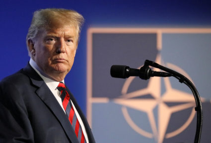 President Donald Trump looks on as he holds a news conference after participating in the NATO Summit in Brussels, Belgium. Photo by Reinhard Krause/Reuters