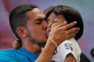 Javier, a 30 year old from Honduras, holds his 4-year old-son William during a July news conference in New York after they were reunited after being separated for 55 days following their detention at the Texas border. Photo by Lucas Jackson/Reuters