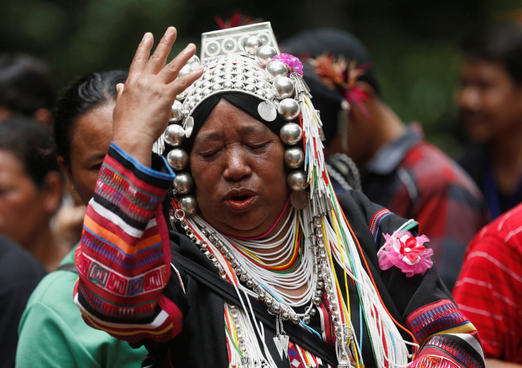 An ethnic Akha woman prays for the return of the missing members of an under-16 soccer team and their coach, near the Tham Luang cave complex, as an ongoing search for them continues, in the northern province of Chiang Rai, Thailand, June 30, 2018. Photo by Soe Zeya Tun/Reuters