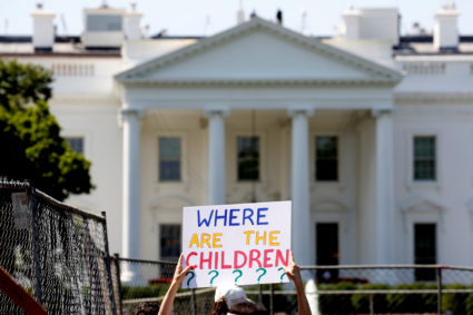 An immigration activists hold signs against family separation during a rally to protest against the Trump Administration's immigration policy outside the White House in Washington, U.S., June 30, 2018. REUTERS/Joshua Roberts - RC1ECD4643F0