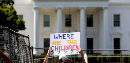 An immigration activists hold signs against family separation during a rally to protest against the Trump Administration's immigration policy outside the White House in Washington, D.C. Photo by Joshua Roberts/Reuters