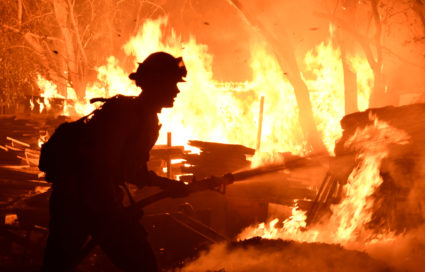 Firefighters battle a fast-moving wildfire that destroyed homes driven by strong wind and high temperatures forcing thousands of residents to evacuate in Goleta, California. Photo by Gene Blevins/Reuters