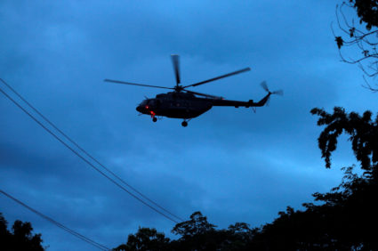 A military helicopter believed to be carrying rescued schoolboys takes off near Tham Luang cave complex in the northern province of Chiang Rai, Thailand, July 8, 2018. Photo by Soe Zeya Tun/Resuters
