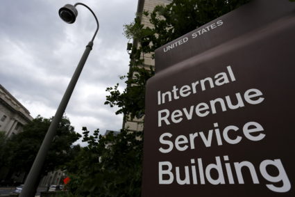 A security camera hangs near a corner of the U.S. Internal Revenue Service (IRS) building in Washington, D.C., in 2015. Photo by Jonathan Ernst/Reuters