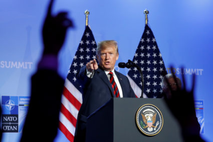 President Donald Trump takes questions from the media during a news conference after participating in the NATO Summit in Brussels, Belgium. Photo by Kevin Lamarque/Reuters