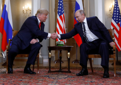 President Donald Trump and Russia's President Vladimir Putin shake hands as they meet in Helsinki, Finland, on July 16, 2018. Photo by Kevin Lamarque/Reuters