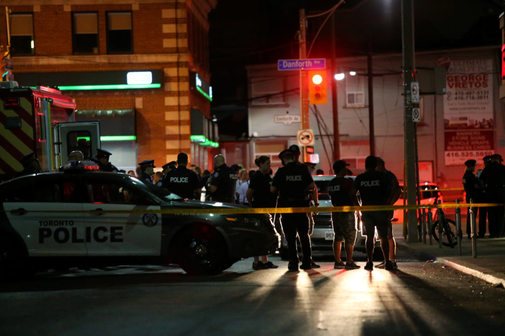 Police are seen near the scene of a mass shooting in Toronto, Canada. Photo by Chris Helgren/Reuters