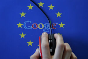 A woman hovers a mouse over the Google and European Union logos in this April 15, 2015 photo illustration. This logo has been updated and is no longer in use. Photo by Dado Ruvic/Illustration/File Photo via Reuters
