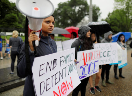 Demonstrator Sara Mathews plays a recording of the cries of illegal immigrant children held in a U.S. detention facility after being separated from their parents during a protest against the separation of immigrant families outside the White House in Washington, U.S., June 22, 2018. REUTERS/Jim Bourg