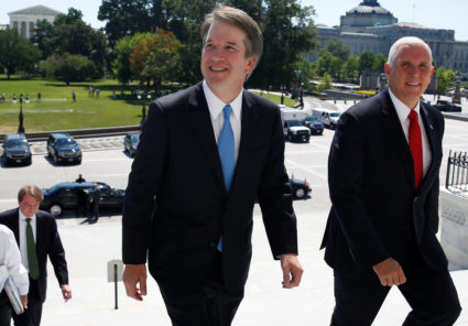 With the U.S. Supreme Court building in the background, Supreme Court nominee judge Brett Kavanaugh arrives with U.S. Vice President Mike Pence prior to meeting with Senate Majority Leader Mitch McConnell on Capitol Hill in Washington, U.S., July 10, 2018. REUTERS/Joshua Roberts