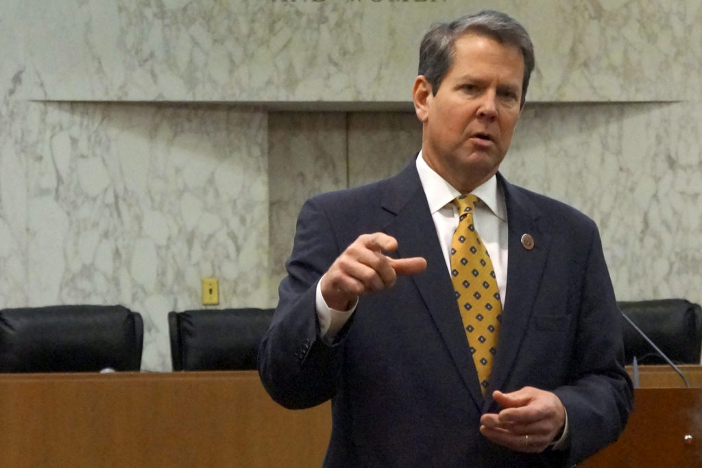 FILE PHOTO: Georgia Secretary of State Brian Kemp speaks with visitors to the state capitol about the "SEC primary" involv...