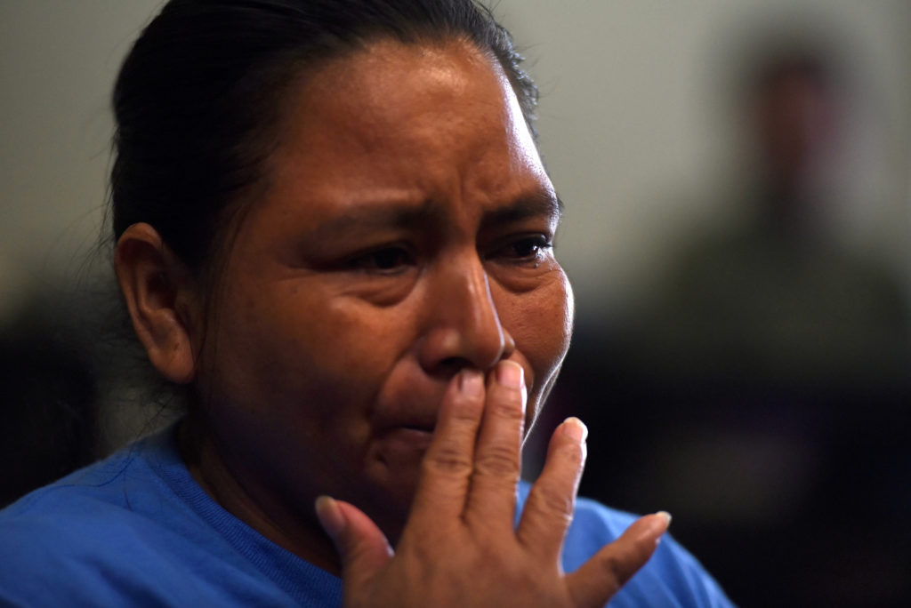 After being reunited with her daughter, Sandra Elizabeth Sanchez, of Honduras, speaks with media at Catholic Charities in ...