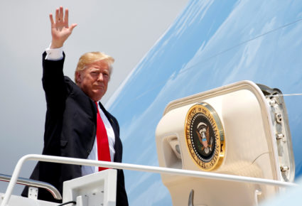 President Donald Trump waves while boarding Air Force One before departing for Great Falls, Montana at Joint Base Andrews, Maryland outside Washington, U.S., July 5, 2018. REUTERS/Joshua Roberts