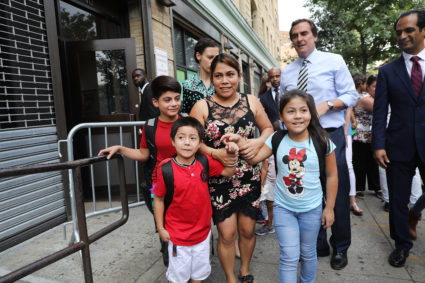 Yeni Gonzalez-Garcia (center) was reunited with her three children at the East Harlem Cayuga Centers on July 13 in New York City. Gonzalez-Garcia, from Guatemala, was held away from her children as part of President Donald Trump's controversial zero-tolerance policy of removing immigrant children from their parents after they are detained. The policy was later reversed. Photo by Spencer Platt/Getty Images