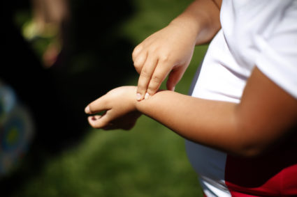 Fernanda Garcia-Villanueva, 8, takes her pulse at a group exercise session in the 10-week Shapedown Program at The Children's Hospital in Aurora, Colorado May 29, 2010. The program is part of the child and teen weight management program at the hospital. REUTERS/Rick Wilking