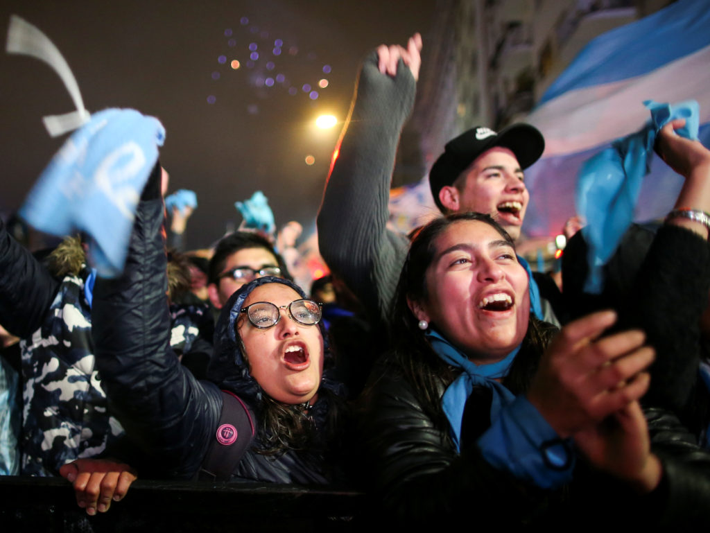Anti-abortion activists celebrate lawmakers rejecting a bill to legalize elective abortion in Buenos Aires, Argentina on A...