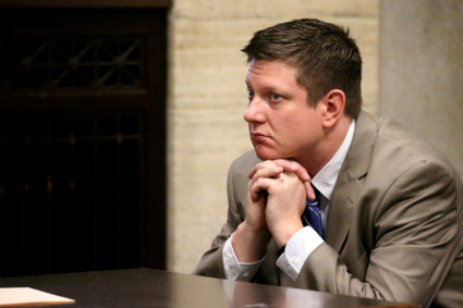 Chicago police officer Jason Van Dyke listens during his 2017 hearing in his shooting case of Laquan McDonald at the Leighton Criminal Court Building in Chicago, Illinois. Photo by Antonio Perez/Chicago Tribune via Reuters